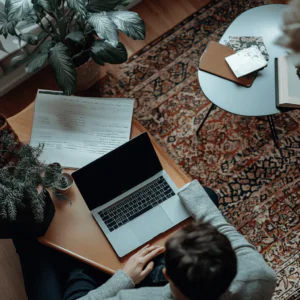 a person doing work on his laptop