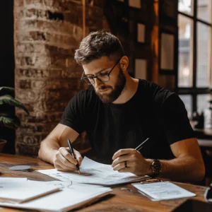 man filling out paperwork